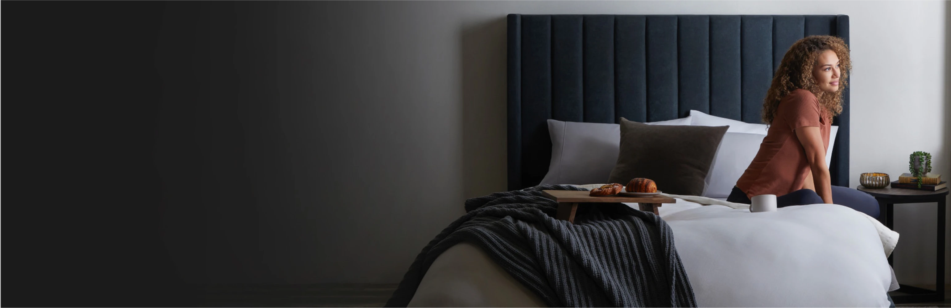 Woman sitting on a magniflex mattress